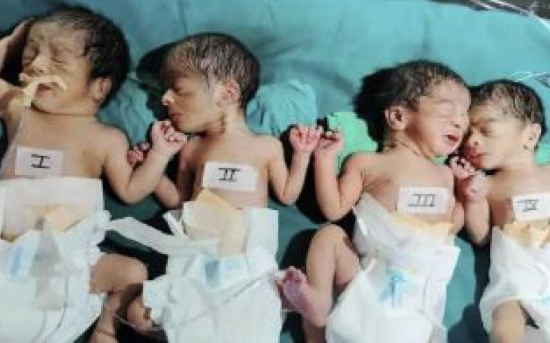 The woman gave birth to four children at once, a son and three daughters.