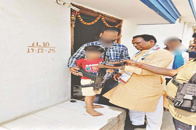  MLA hands gun to child, photo goes viral, sparks uproar latest news big news gariyaband khabargali 